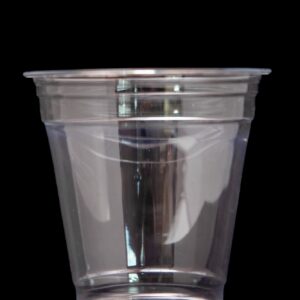Clear plastic cup against a black background.