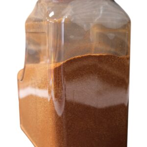 A plastic container filled with layered spices or powders.