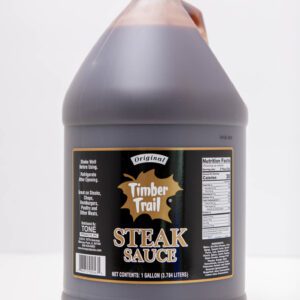 Large container of Trademark Trail steak sauce with a black label.
