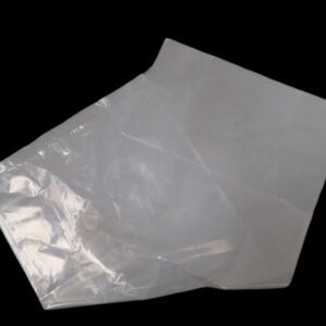 A folded transparent plastic bag on a black background.