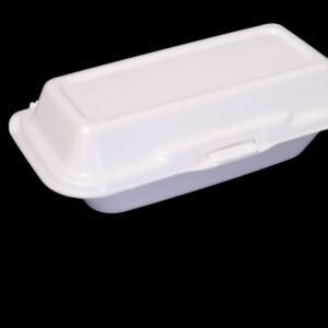 White foam food container with lid against black background.