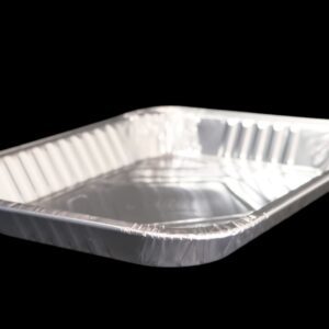 A rectangular aluminum foil tray with a clear plastic lid on a black background.