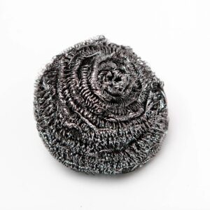 A coiled metal scrubber for cleaning.
