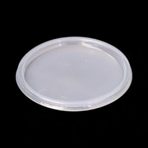 A transparent plastic lid on a black background.