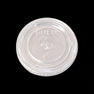 Clear plastic lid for a disposable cup on a black background.