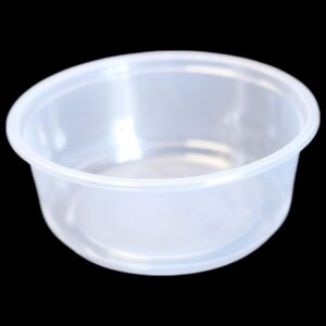 Clear plastic container with a lid on a black background.
