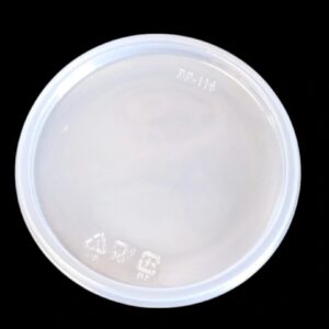 White plastic lid on a black background.