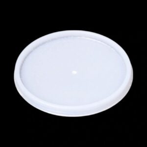 A plain white plastic lid on a black background.
