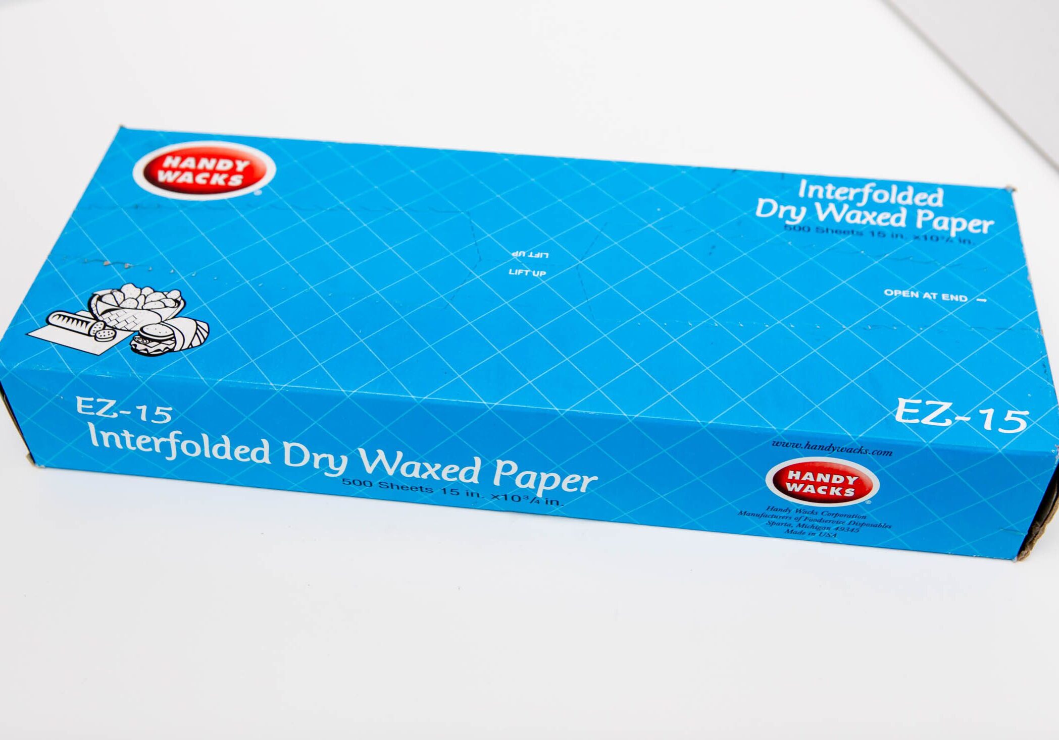 Box of interfolded dry waxed paper sheets with fresh seal.
